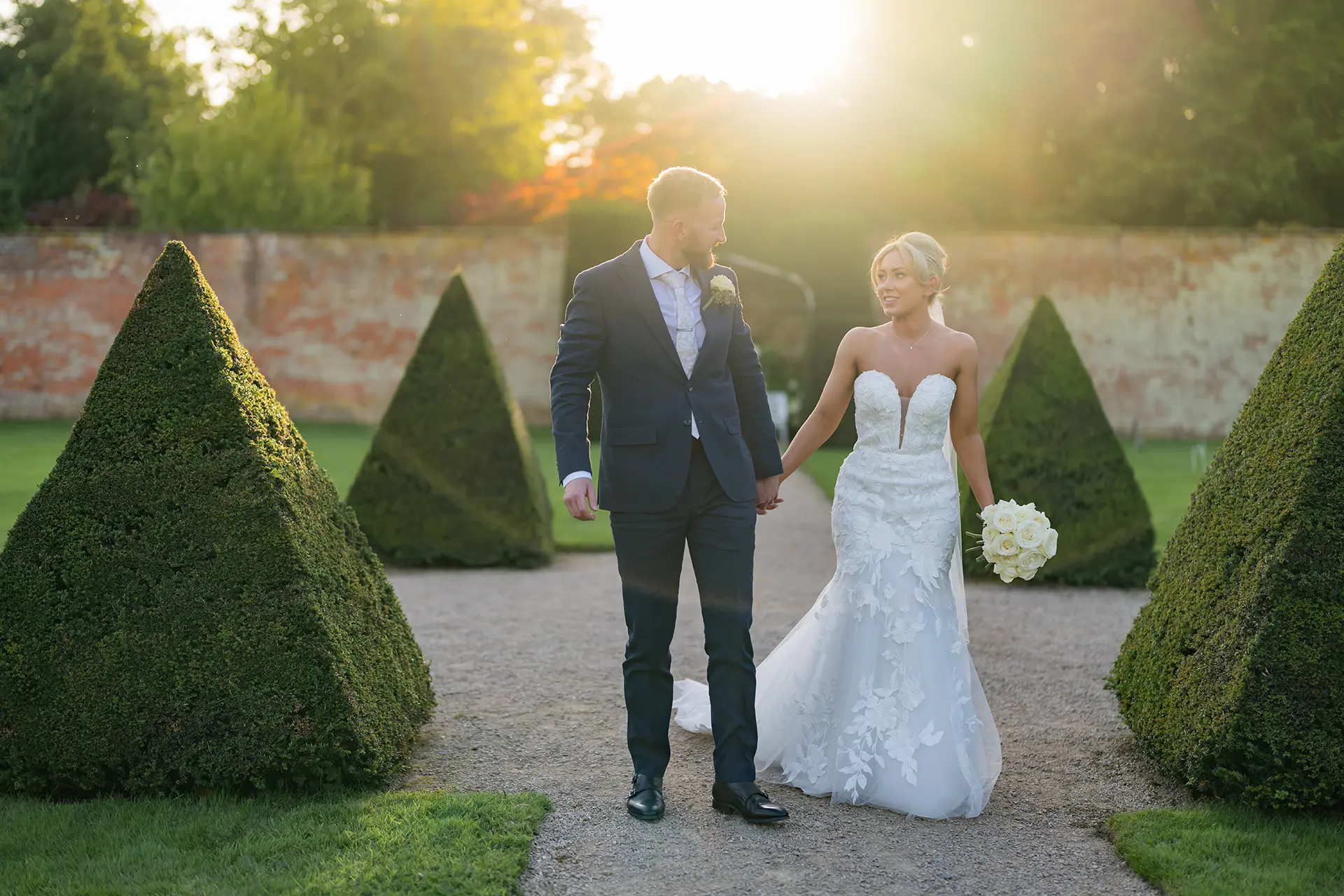 Combermere Abbey couple in gardens at sunset