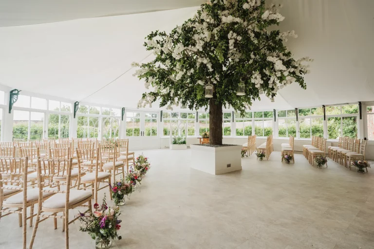 Combermere Abbey glasshouse wedding ceremony setup