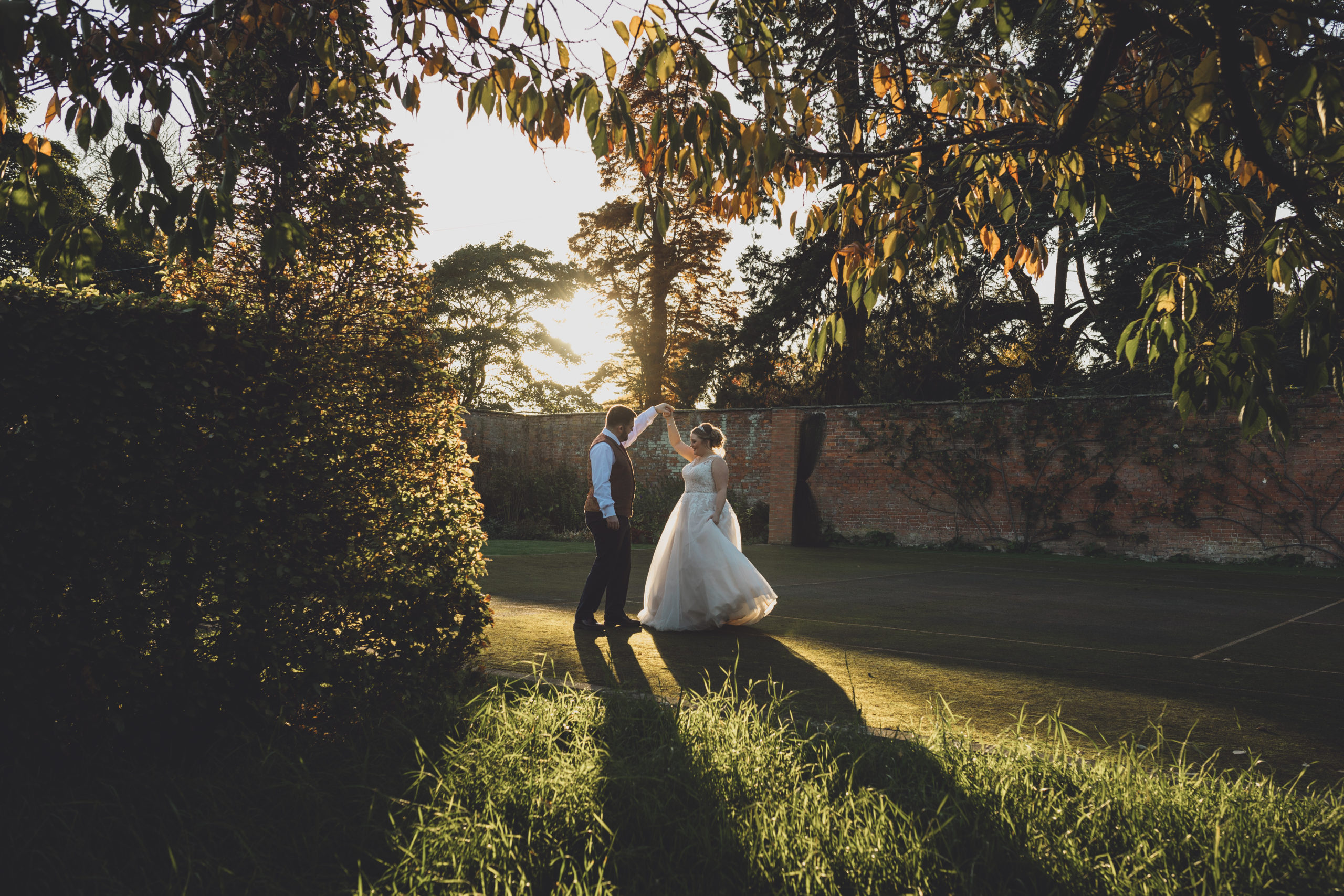 Golden hour wedding photography - a dance at sunset at Combermere Abbey