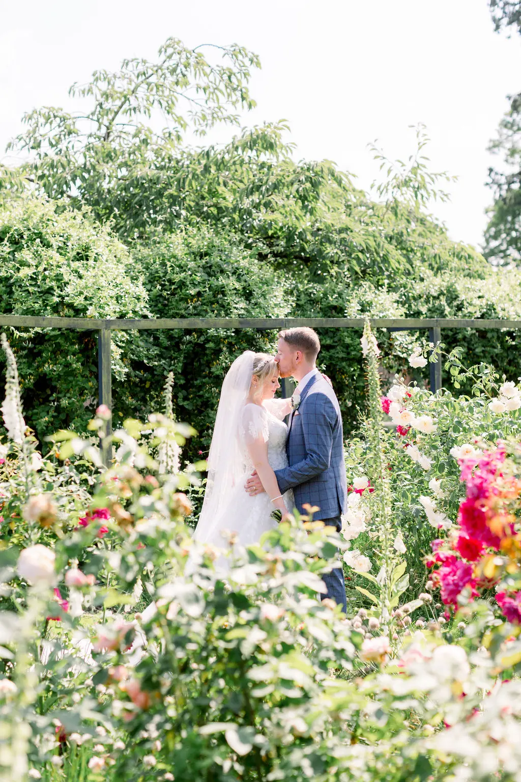 Combermere Abbey couple in summer garden