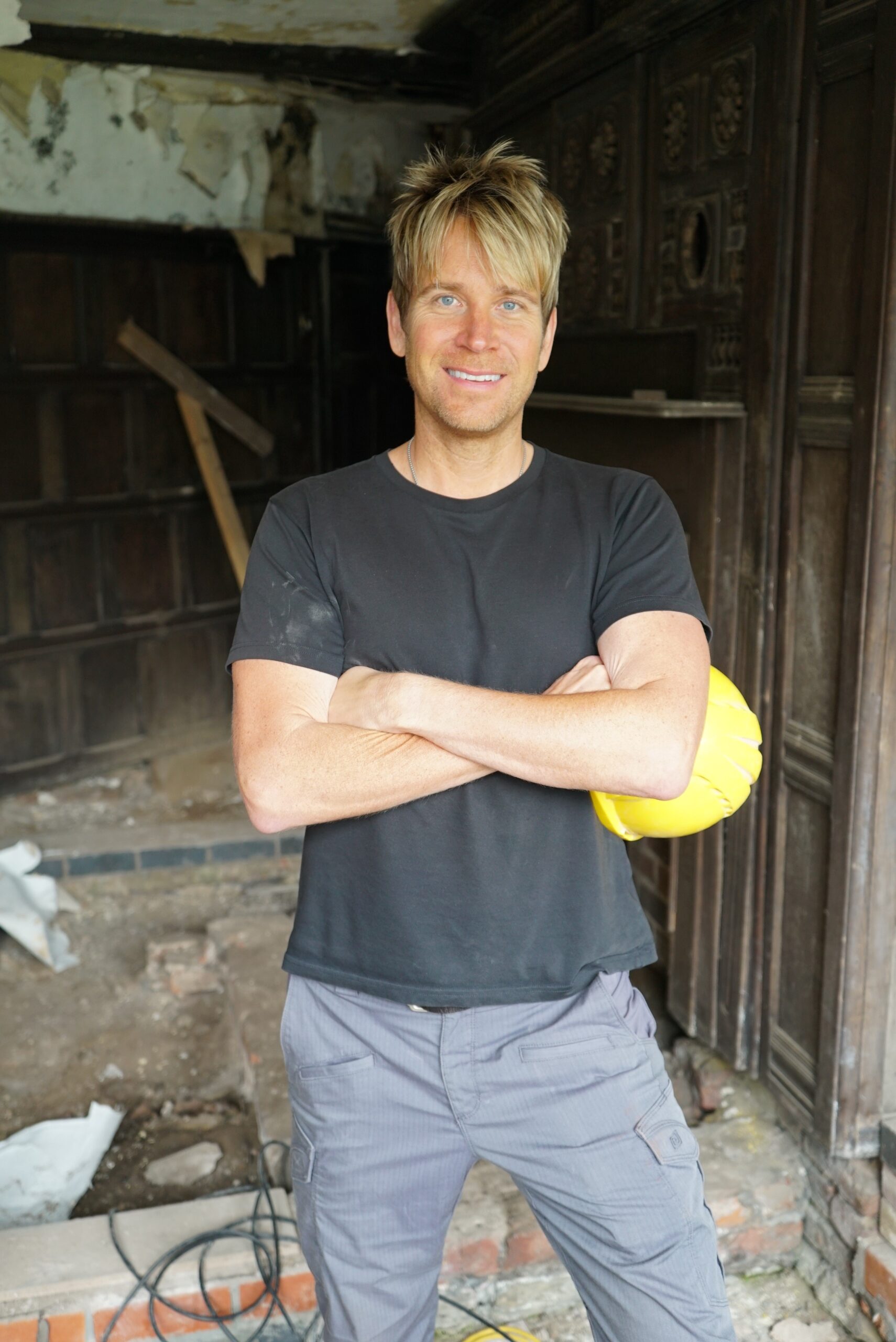 A photo of Hopwood DePree standing in Hopwood Hall during restoration works.