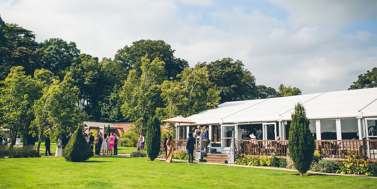 Guests make their way to the wedding reception held in the Pavilion – wedding venues in Cheshire