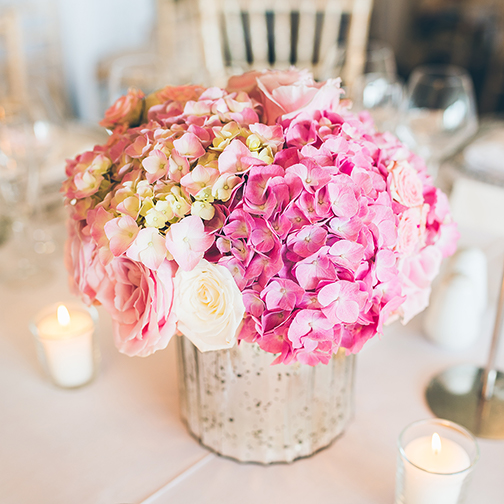 The couple’s wedding flowers were a mix of pink hydrangeas and roses – summer wedding ideas