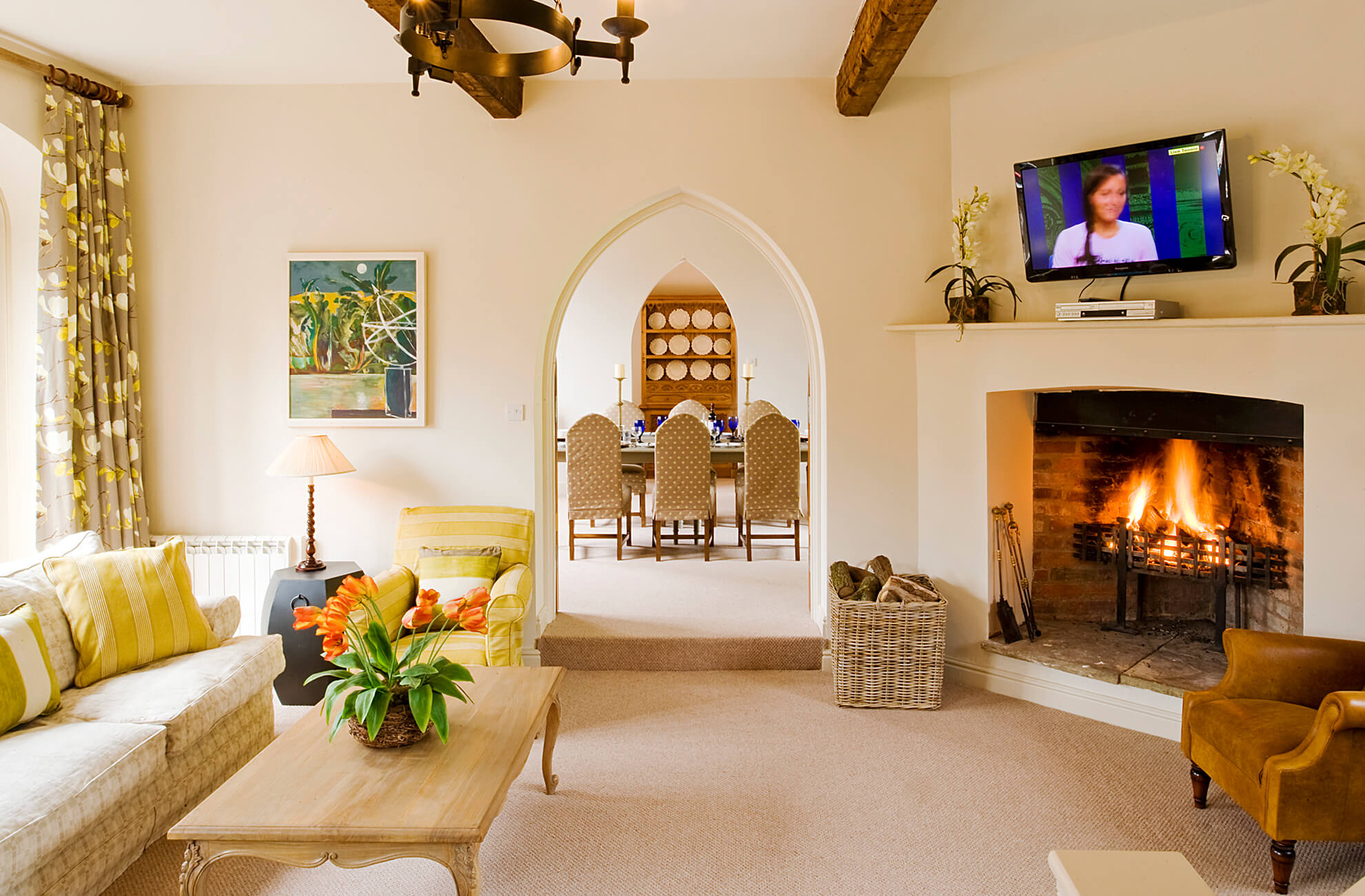 The elegant Malbanc sitting room is a perfect place to cosy up by a fire at Combermere Abbey