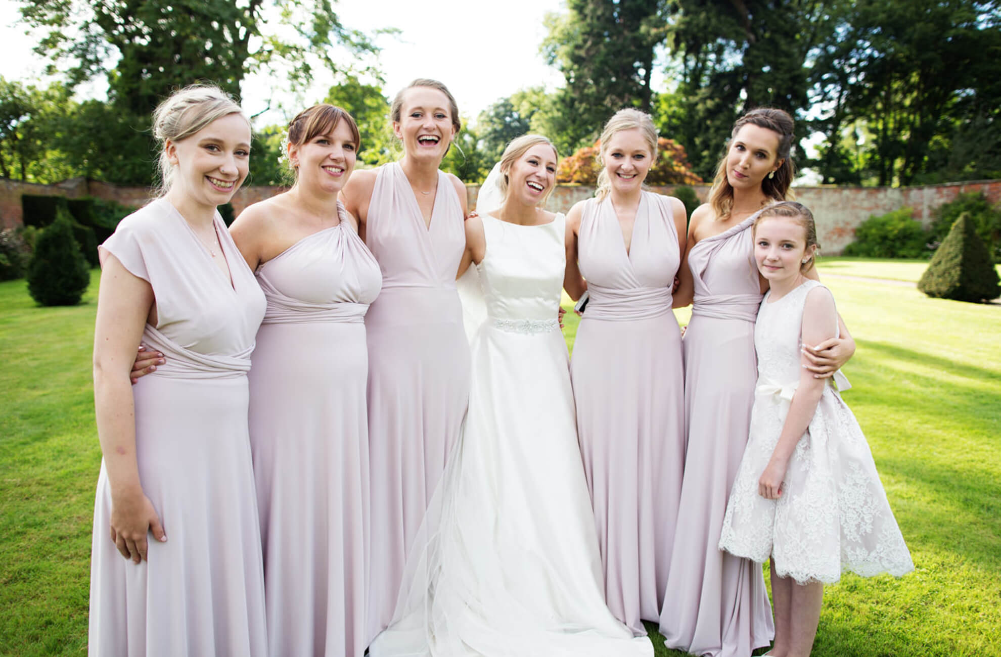 Bridesmaids at Combermere Abbey wear lilac multiway bridesmaid dresses