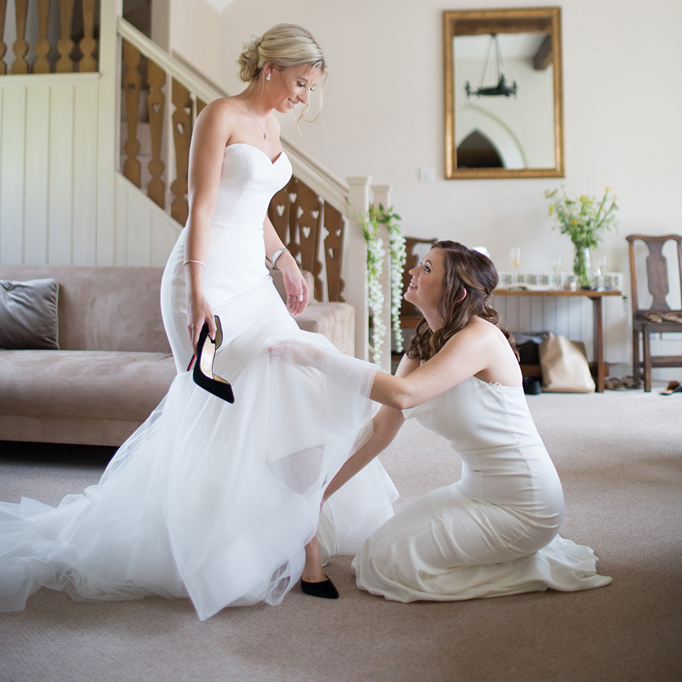 A bride makes her final preparations in one of the self-catering cottages at Combermere Abbey