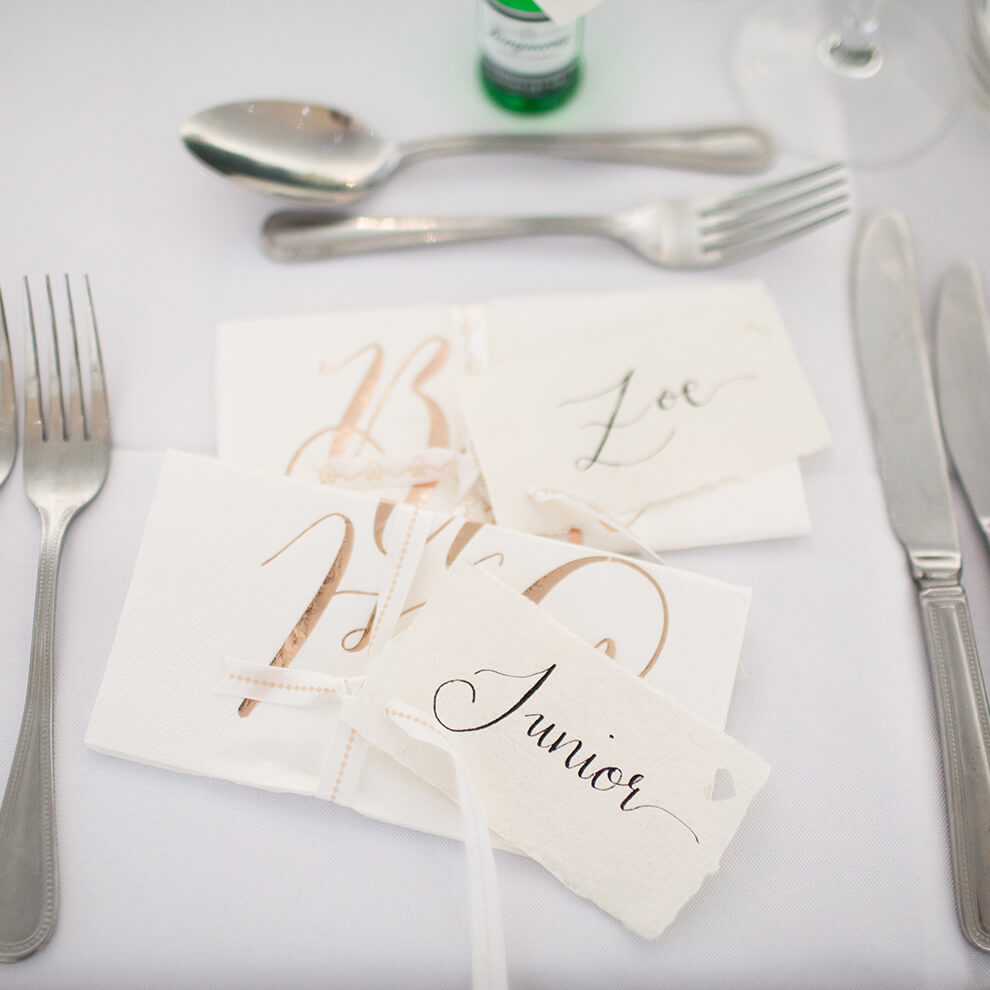 Wedding favours doubled up as name cards for the wedding reception at Combermere Abbey