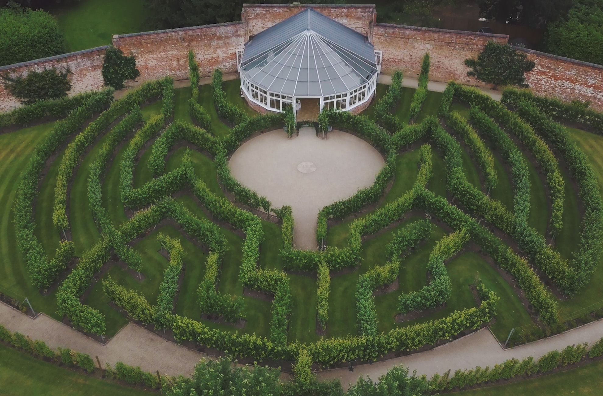 The Fruit Tree Maze at Combermere Abbey surrounds the beautiful Glasshouse which is perfect for a wedding ceremony