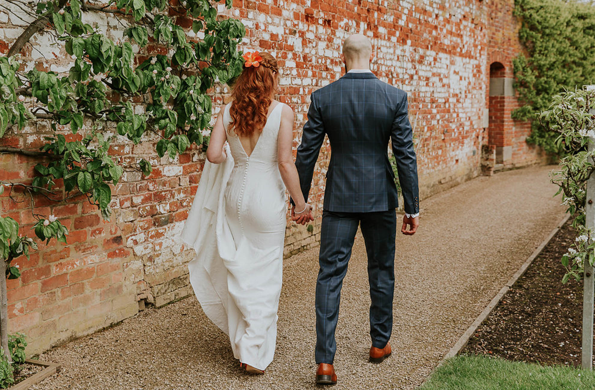 Newlyweds explore the grounds at Combermere Abbey wedding venue in Cheshire