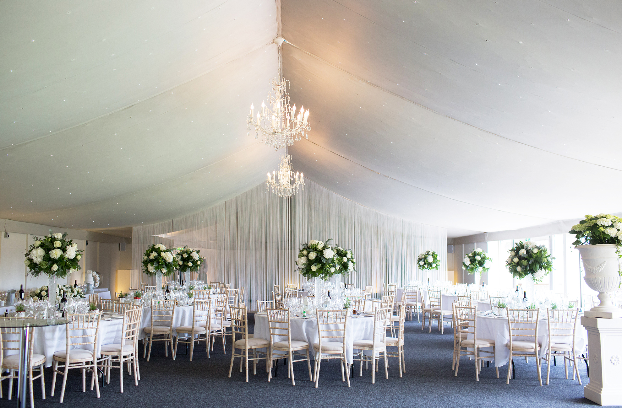 The Garden Pavillion at Combermere Abbey wedding venue in Cheshire is set up for an elegant wedding reception