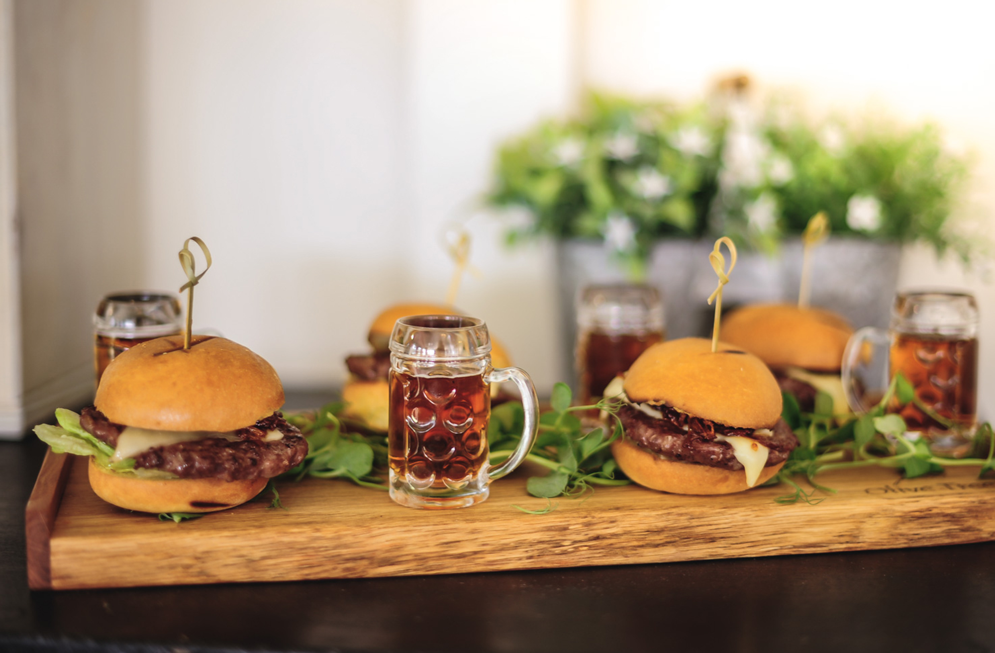 A couple chose burgers as a simple wedding food idea for their wedding at Combermere Abbey