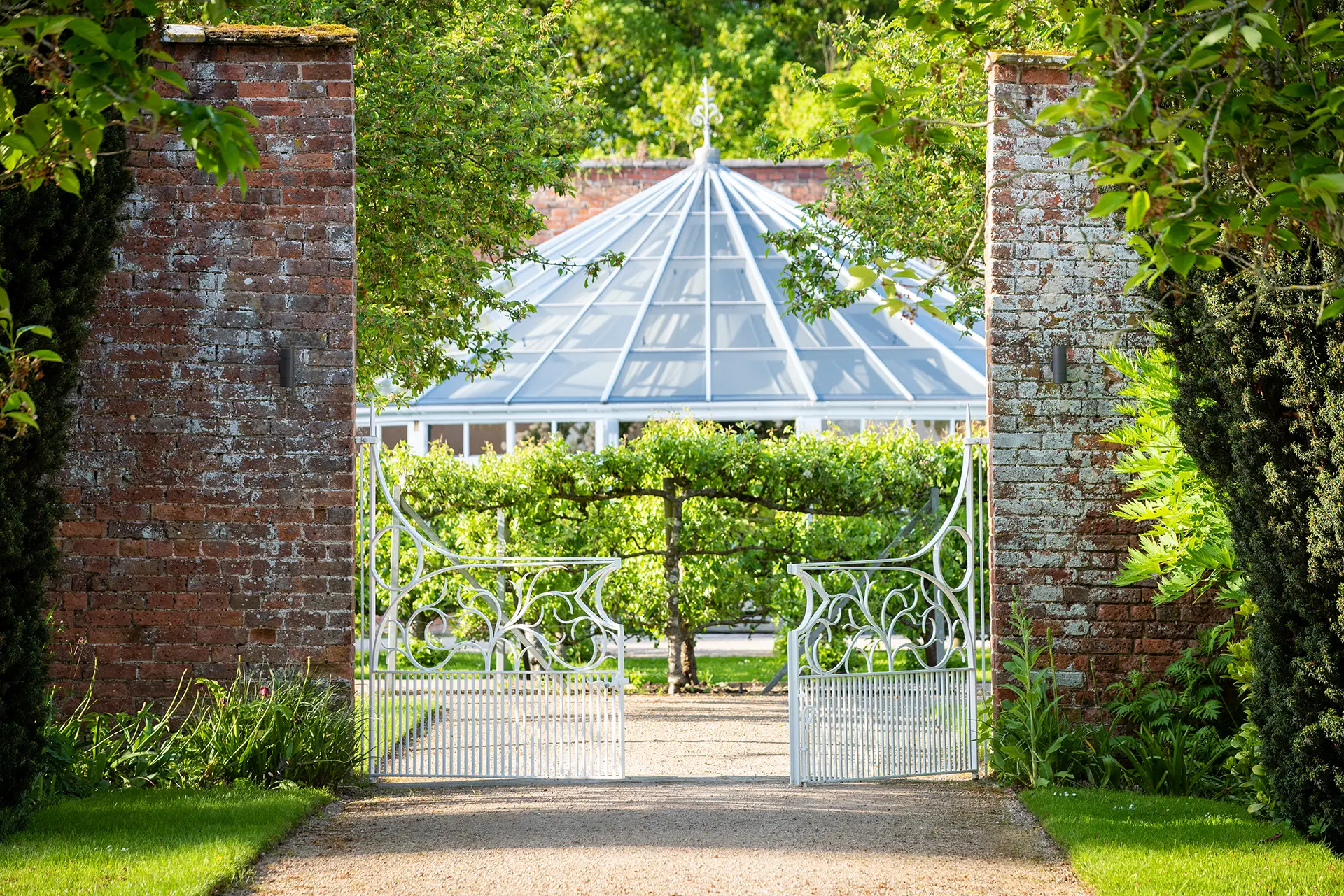 combermere abbey gardens the glass house gates